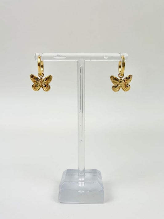 Faye Butterfly Huggies Earrings in at Wrapsody