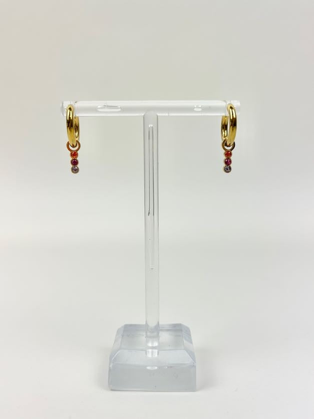 Marigold Huggies Earrings in at Wrapsody