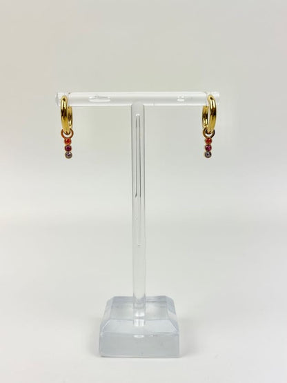 Marigold Huggies Earrings in at Wrapsody