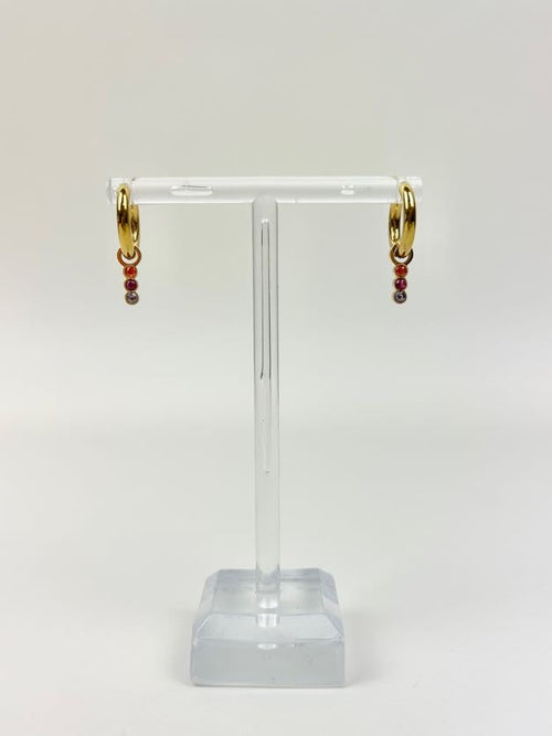 Marigold Huggies Earrings in at Wrapsody