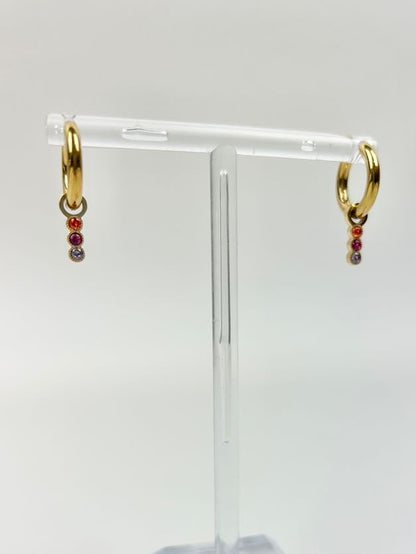 Marigold Huggies Earrings in at Wrapsody