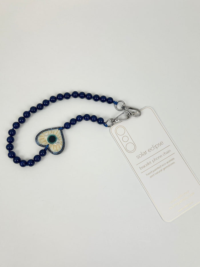 Solar Eclipse Coastal Lucky Eye Phone Chain Bracelet Travel Accessories in at Wrapsody