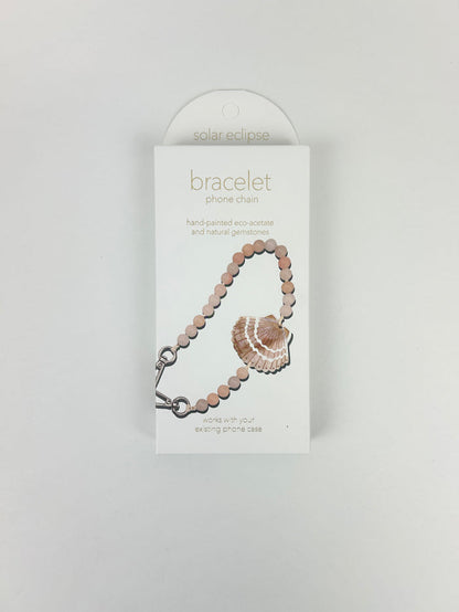Solar Eclipse Seashell Phone Chain Bracelet Travel Accessories in at Wrapsody