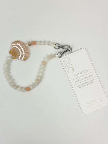 Solar Eclipse Seashell Phone Chain Bracelet Travel Accessories in at Wrapsody